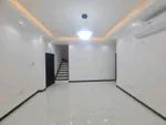 A villa for rent consists of 4 rooms, a majlis and a hall, ready to live, with electricity and water, and close to the exit of Dubai and Sharjah. All services are available : Image 1