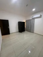 Two bedroom apartment with two bathrooms and balcony for annual rent in Al-Bostan area in front of the city police station : Image 2