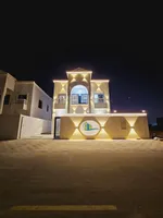 Villa for sale in Ajman, Al-Zahia area, two floors with a stone face, a modern super deluxe design, directly on a neighbor street, with the possibility of easy bank financing. Villas of different designs : Image 1