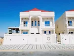 For sale, including registration and ownership fees, in Ajman, Al Aliyah area, two floors, stone face, central air conditioning, directly on Jar Street, with the possibility of easy bank financing, villas of different designs. : Image 1