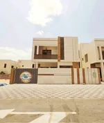 Villa for sale in Ajman, Al Yasmeen area, with two floors and a roof facing a central air conditioning stone directly on a neighbor street, with the possibility of easy bank financing : Image 1