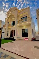 With a swimming pool, a villa for sale in Ajman, Al Amira area, two floors facing a stone directly on a neighbor street, with the possibility of easy bank financing : Image 1
