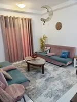 For rent, a furnished apartment with a living room : Image 2