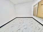 An apartment for rent in Mohammed Bin Zayed consists of a room, a hall and a bathroom : Image 2