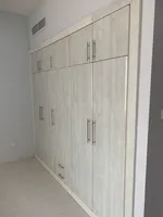 For rent, a room and a lounge with an open view, free air conditioning, a gym, and a free swimming pool in the Al Qasba area : Image 2