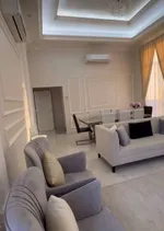 A new villa for sale in Sharjah, Al Hoshi area, consists of 5 master bedrooms, a hall, a majlis and a kitchen. There is an external extension with a kitchen, a maid's room, a laundry room, a pantry and an ironing room : Image 6