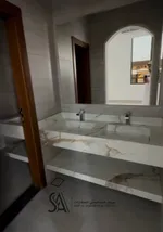 For sale a villa in the Emirate of Sharjah, Al-Hoshi area, with a modern design, completely stone, consisting of 4 master bedrooms, two halls, a kitchen ready with all the electrical appliances, a maid's room and a laundry room : Image 5