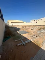 For annual rent, a fenced land (a plot of land) with an area of ​​15,000 square feet in Umm Al Quwain : Image 1