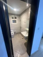 For rent a one-bedroom apartment with a balcony in Ajman, Al Nuaimia area 2. The building has a swimming pool and a parking : Image 8