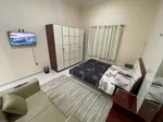 For rent a monthly furnished studio, separate kitchen, central air conditioning, in Ajman, Al Rawdah 2, Sheikh Ammar Street, easy exit to Dubai, including bills : Image 3