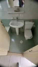 For annual rent, a studio apartment, a separate kitchen, a bathroom, a distinctive area, close to the Gulf Bridge, close to the exit of Dubai and Sharjah : Image 3