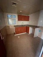 A spacious apartment with a balcony and a bathroom. The address is Al Nuaimah, close to King Faisal Street and Kuwait Street, Ali Mohammed bin Zayed Street, directly exit Dubai and Sharjah//Apartment with one bedroom, a living room, a balcony, and a  : Image 7