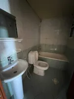 A spacious apartment with a balcony and a bathroom. The address is Al Nuaimah, close to King Faisal Street and Kuwait Street, Ali Mohammed bin Zayed Street, directly exit Dubai and Sharjah//Apartment with one bedroom, a living room, a balcony, and a  : Image 2