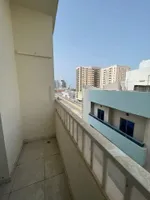 A spacious apartment with a balcony and a bathroom. The address is Al Nuaimah, close to King Faisal Street and Kuwait Street, Ali Mohammed bin Zayed Street, directly exit Dubai and Sharjah//Apartment with one bedroom, a living room, a balcony, and a  : Image 4