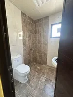 For rent a villa in the Emirate of Sharjah in the Tarfa area consisting of 4 bedrooms, a maid's room, an outdoor kitchen and an external extension consisting of master bedrooms, a hall and a car umbrella. The land area is 8000 square feet. 120 thousa : Image 5