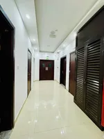 A furnished apartment with a room and a hall : Image 1