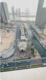 Two rooms and a hall with a balcony and a view of Al Mamzar Lake and Al Qasba Mosque : Image 2