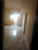 For annual rent in Al Rawdah 2, Ajman, a room and a balcony on Ammar Main Street/For annual rent in Al Rawda 2, Ajman One bedroom and a living room with a balcony on Ammar Main Street : Image 4