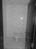 For annual rent in Al Rawdah 2, Ajman, a room and a balcony on Ammar Main Street/For annual rent in Al Rawda 2, Ajman One bedroom and a living room with a balcony on Ammar Main Street : Image 5