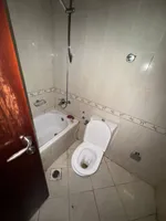 A room and a hall with a balcony, 2 bathrooms, City Tower, for annual rent in Ajman : Image 8