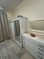 A room and a hall with a balcony, 2 bathrooms, City Tower, for annual rent in Ajman with furniture : Image 3