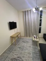 A room and a hall with a balcony, 2 bathrooms, City Tower, for annual rent in Ajman with furniture : Image 6