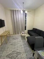 A room and a hall with a balcony, 2 bathrooms, City Tower, for annual rent in Ajman with furniture : Image 7