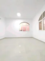 A room and a hall with a balcony for rent in Shakhbout City : Image 3