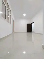 A room and a hall with a balcony for rent in Shakhbout City : Image 4