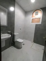 A room and a hall with a balcony for rent in Shakhbout City : Image 6