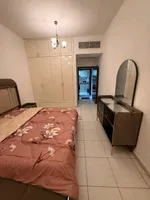 A furnished apartment with a room and a hall : Image 2