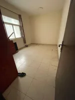 A one-bedroom apartment with a balcony, a separate hall, a large area. The address is Al Nuaimiya in Ajman, close to the exit of Dubai and Sharjah. A one-bedroom apartment with a bathroom, a balcony, a separate living room, and a large area. Located  : Image 2