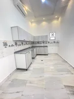 An extension of four rooms and a hall for rent in Khalifa City A : Image 4