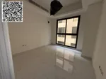 For annual rent in Ajman, a new building is available. The first resident is available. A two-room apartment, a hall, a majlis with 2 bathrooms, a balcony with an open view, a spacious area, central air conditioning, wall cabinets with a free month,  : Image 2