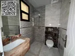 For annual rent in Ajman, a new building is available. The first resident is available. A two-room apartment, a hall, a majlis with 2 bathrooms, a balcony with an open view, a spacious area, central air conditioning, wall cabinets with a free month,  : Image 4