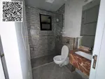 For annual rent in Ajman, a new building is available. The first resident is available. A two-room apartment, a hall, a majlis with 2 bathrooms, a balcony with an open view, a spacious area, central air conditioning, wall cabinets with a free month,  : Image 7