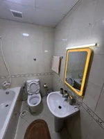 غرفه وصاله مع بلكونه 2 حمام ابراج السيتى تاورللايجار شهرى بعجمان : Image 8