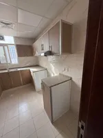 Two rooms and a hall for the first resident of Al Jerf 3 new tower for annual rent in Ajman with wall cabinets and a store : Image 2