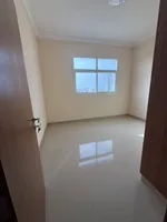 Two rooms and a hall for the first resident of Al Jerf 3 new tower for annual rent in Ajman with wall cabinets and a store : Image 3