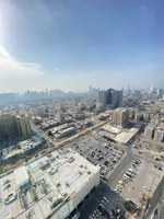 A room and a hall for sale in Al-Waha Towers, a kitchen, two bathrooms with a view of the city, a park, a swimming pool, a gym. The apartment is delivered immediately : Image 2