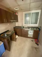 A room and a hall for sale in Al-Waha Towers, a kitchen, two bathrooms with a view of the city, a park, a swimming pool, a gym. The apartment is delivered immediately : Image 3