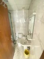 A room and a hall for sale in Al-Waha Towers, a kitchen, two bathrooms with a view of the city, a park, a swimming pool, a gym. The apartment is delivered immediately : Image 4