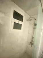 A room and a hall for sale in Al-Waha Towers, a kitchen, two bathrooms with a view of the city, a park, a swimming pool, a gym. The apartment is delivered immediately : Image 6