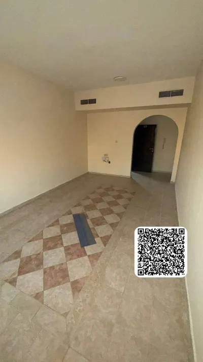 For annual rent in Ajman ♨️ A spacious room and hall with a balcony 👈 👈 Location: in Rashidiya 1 near Al Meena Tower Street : Image