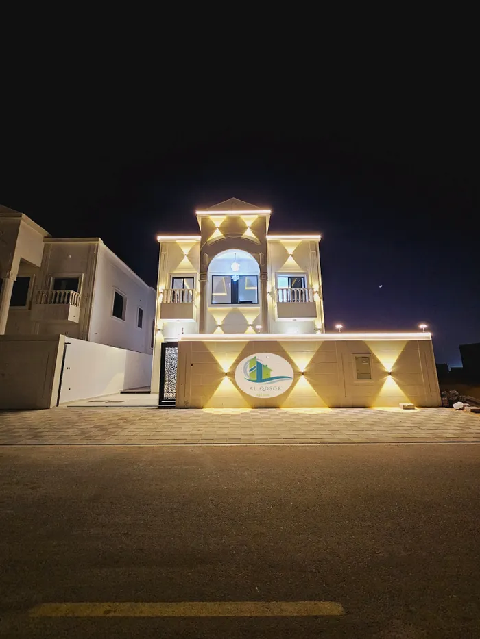 Villa for sale in Ajman, Al-Zahia area, two floors with a stone face, a modern super deluxe design, directly on a neighbor street, with the possibility of easy bank financing. Villas of different designs : Image 1