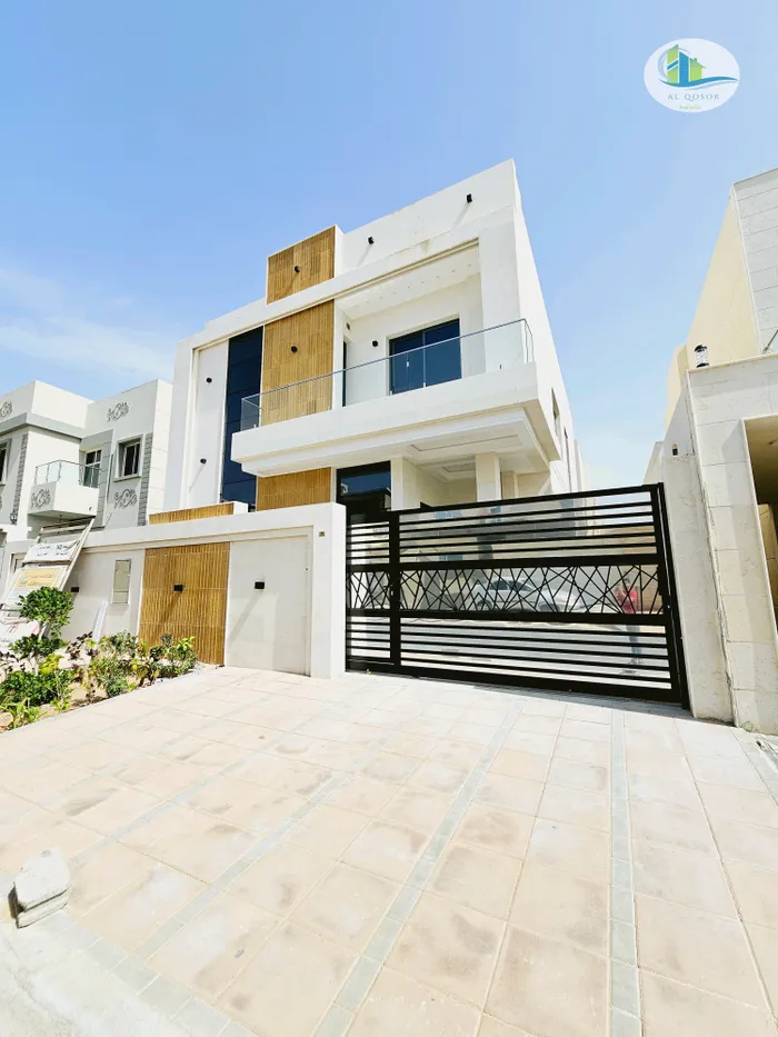 Near a mosque, a villa for sale in Ajman, Al Yasmeen area, has two floors facing a modern super deluxe stone design directly on a neighbor street with the possibility of bank financing : Image 1