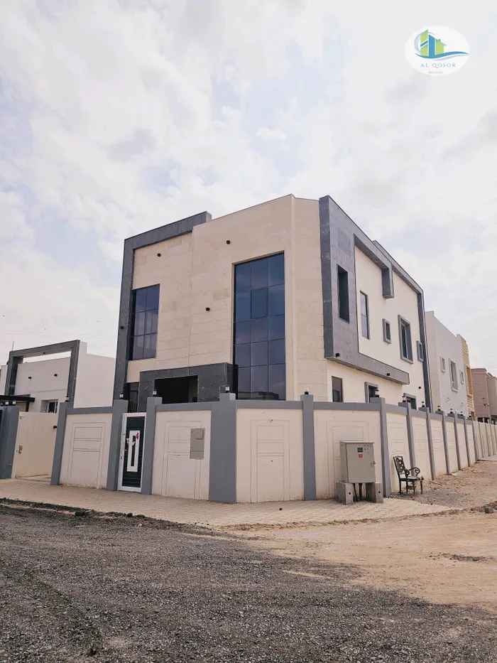 Villa for sale in Ajman, Al Helio area, with two floors facing a stone corner of two streets, with the possibility of easy bank financing : Image 1