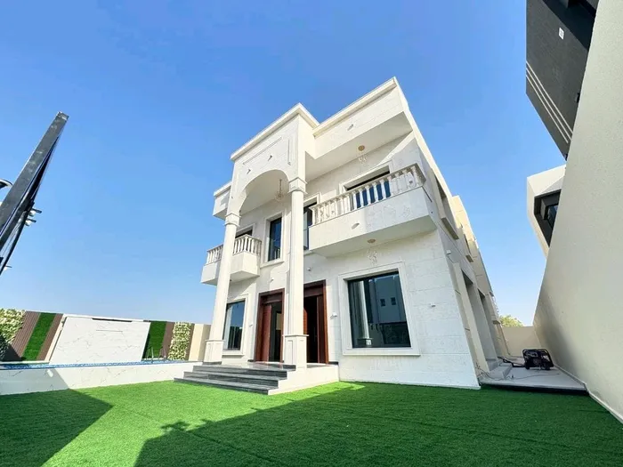 Villa for sale in Ajman, Al-Zahia area, two floors facing a stone directly on a neighbor street, with the possibility of easy bank financing : Image 1