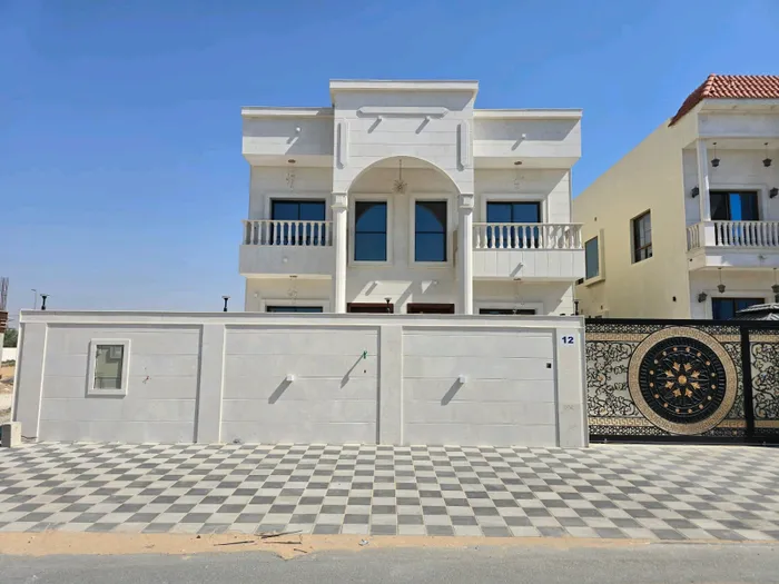 Villa for sale in Ajman, Al-Zahia area, two floors facing a stone directly on a neighbor street, with the possibility of easy bank financing : Image 1