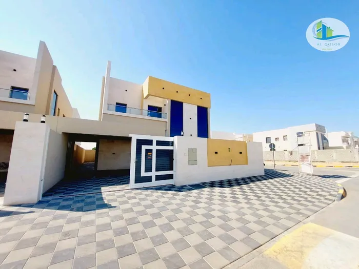 فيلا للبيع بعجمان منطقة الزاهيه طابقين وجهه حجر تكيف مركزى تصميم مودرن مختلف التشطيبات مع امكانية التمويل البنكي الميسر : Image 1